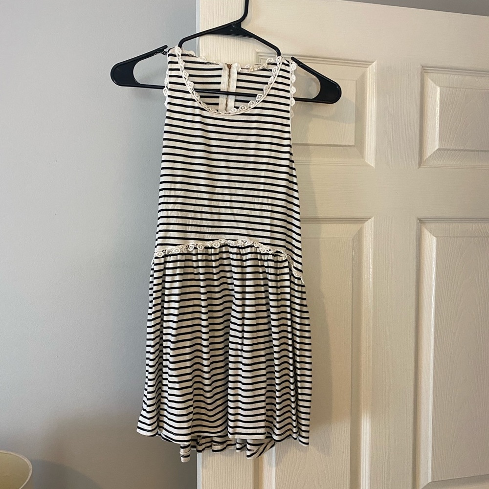 Black and white striped tank with babydoll fit. Size medium.